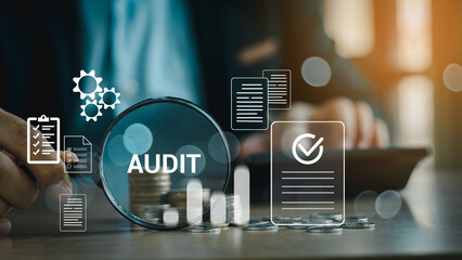 Audit business concept. Businessmen Using Magnifying Glass to check and evaluate financial statements. Auditing financial accounts within the organization. Audit And Fraud Investigation.