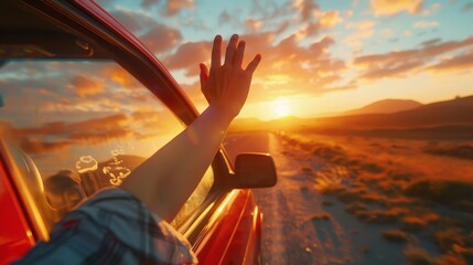 hand outside open window car with meadow and mountain background.