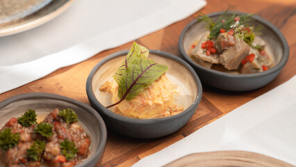 Healthy Mediterranean dishes at an open-air cafe table.