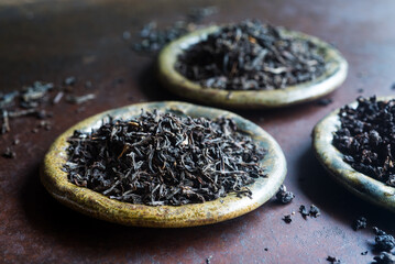 loose leaf black tea on ceramic plates.