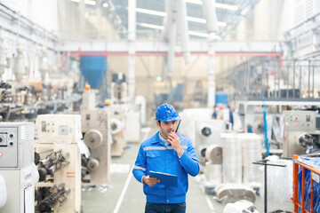 Fototapeta premium The European male engineer plays a pivotal role in managing industrial machinery within the plastic and steel factory, driving excellence in global market penetration.
