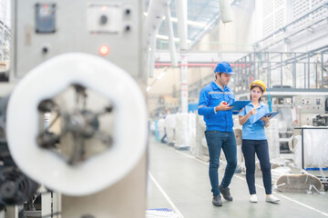 The European male engineer and the Asian female engineer, stationed in the industrial sector,...