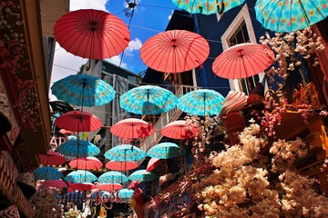 Decorative umbrellas around a fairytale-inspired cafe at Psiri neighbourhood in Athens, Greece,...