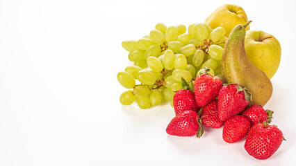 Fruits on a white background - pears, grapes and strawberries for a healthy diet