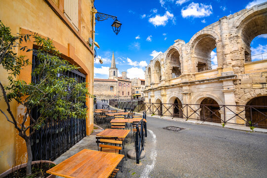 Fototapeta Arles Amphitheatre and colorful street architecture view