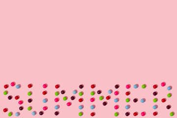 Creative idea made of candies on a pink background. Summer concept.