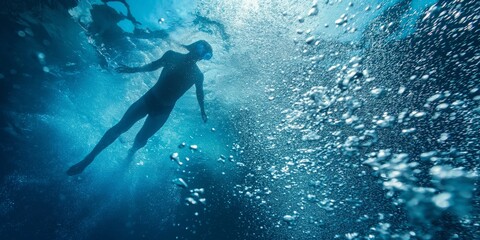 The scene captures the peacefulness, depth and beauty of underwater exploration with a lone diver