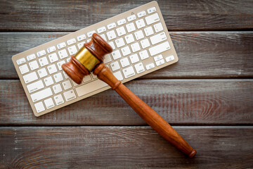 Lawyer desktop with judge gavel and keyboard, top view
