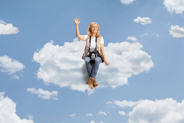 Female photo journalist sitting on a cloud