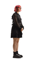 Red-haired woman in black dress standing