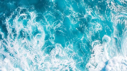   A bird's eye perspective of a body of water with a wave forming at its surface