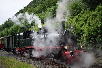 old steam train engine while running