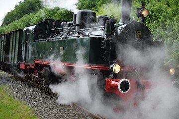 old steam train engine while running