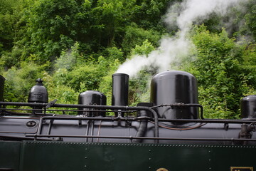 old steam train engine while running