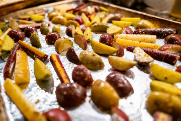Roasted vegetables on the foil going to oven