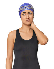 Young Caucasian female professional swimmer touching back of head, thinking and making a choice.
