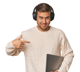 Young student man with a laptop person pointing by hand to a shirt copy space, proud and confident