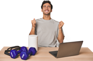 Hispanic trainer planning workout celebrating a victory, passion and enthusiasm, happy expression.