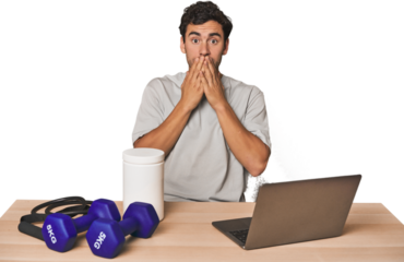 Hispanic trainer planning workout shocked, covering mouth with hands, anxious to discover something new.