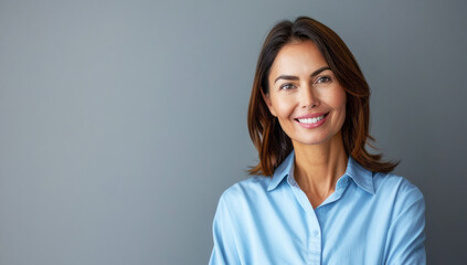 Fototapeta premium Photo of Smiling businesswoman in blue shirt 