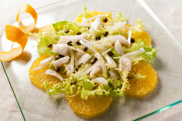 cod salad with orange slices base