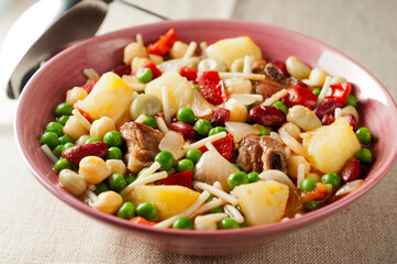 stew of meat, vegetables, legumes and noodles