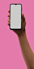Hand holding smartphone on pink background, ideal for vibrant app displays