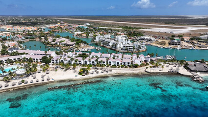 Fototapeta premium Caribbean Houses At Kralendijk In Bonaire Netherlands Antilles. Caribbean Island. Downtown Skyline. Kralendijk At Bonaire Netherlands Antilles. Caribbean Beach Landmark. Colored Buildings.