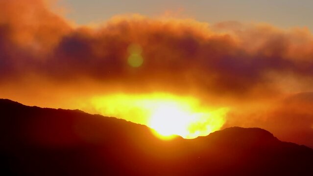 Sunset clouds in Los Machucos at 921 meters above sea level and communicates the villages of Bustablado and San Roque de Riomiera. Pasiegos Valleys, Cantabria, Spain, Europe