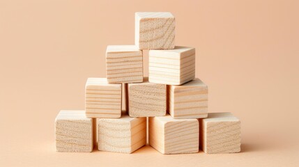 wooden cubes meticulously arranged in the shape of a pyramid against a light background, offering ample copy space for conceptual designs or messages