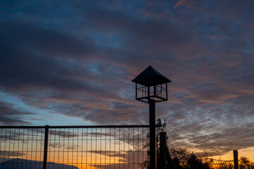 silhouette of a street lamp at sunset