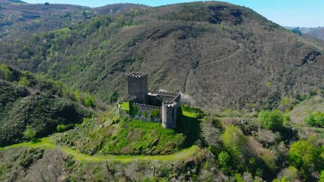 Doiras Castle On The Hilltop In Cervantes, Spain. - aerial approach shot