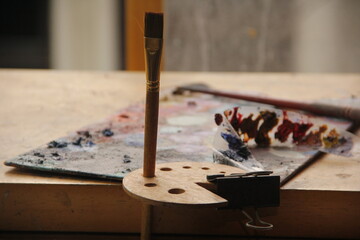 Explore a rich array of colors on a waiting palette, ready to ignite creativity. A solitary brush...