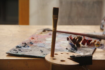 Explore a rich array of colors on a waiting palette, ready to ignite creativity. A solitary brush...