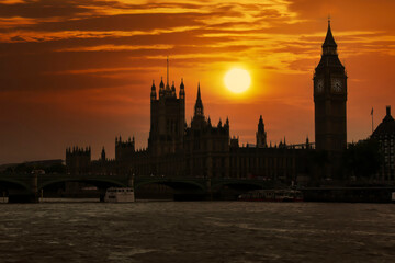 A Magnificent sunrise illuminates the famous Palace of Westminster in London UK