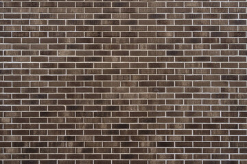 Brown brick wall. Abstract construction background.