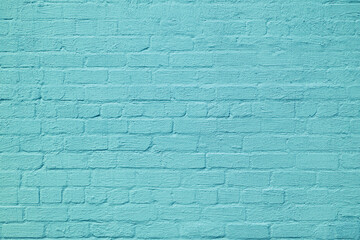 The brick wall is painted with blue paint. Abstract construction background.