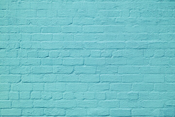 Obraz premium The brick wall is painted with blue paint. Abstract construction background.