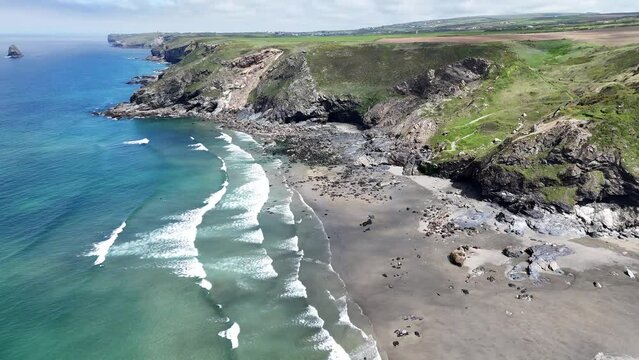 4K aerial footage of north cornwall coastline showing cliffs beaches rocks sea and surf