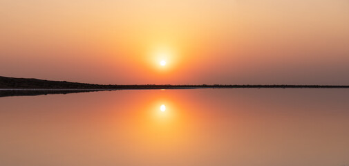 Reflection of the sun in a salt lake.