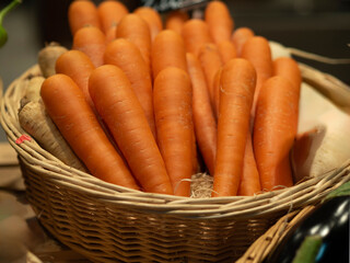 Basket of carrots on display for sale at the market