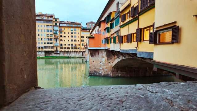 Panoramic view of Ponte Vecchio in Florence, Tuscany, Italy opened in 1345, spanning the Arno River featuring medieval market stalls