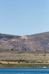 a unique panoramic view over the mono Lake to an dark sandstone mountain range, california