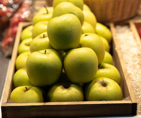  Box of golden apples on display for sale at the market