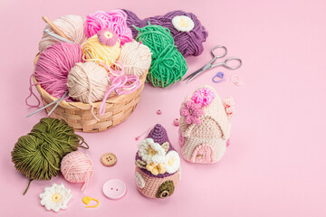Handmade spring decor concept. Creative crocheting, house figurines, traditional flowers and stuff