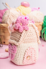 Handmade spring decor concept. Creative crocheting, house figurines, traditional flowers and stuff