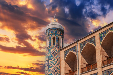 Brick walls decorated with ceramic tiles with oriental pattern of Kukeldash madrasah in Uzbekistan...