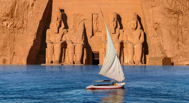 Beautiful Nile scenery with sailboat in the Nile on the way to The Front of the Abu Simbel Temple - Egypt, Africa