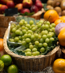 Basket of grape bunches on display for sale at the market