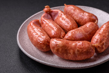 Baked chicken or pork sausages, salt, spices and herbs